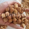 Close-up of dried figs stacked in bulk packaging