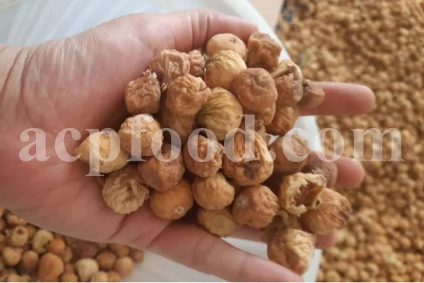 Close-up of dried figs stacked in bulk packaging
