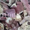 Dried pomegranate peel pieces showing reddish outer skin and cream-coloured inner pith
