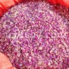 Dried Damask rose petals inside an open bulk bag